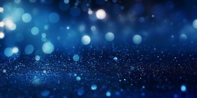 Christmas blue background with lights, bokeh and sparks. New Year holiday. Abstract background, wallpaper. Banner with blurry bokeh and small shiny sprinkles photo