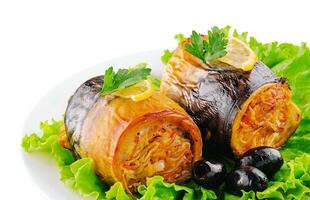 baked fillet of mackerel in rolls with carrots and onions photo