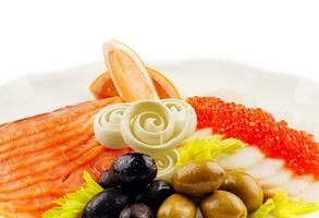 Red and white salted fish in assortment with greenery and lemon photo