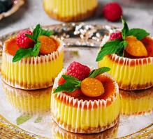 Mini cheesecake with apricot in muffin forms photo