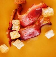 Cream of pumpkin soup with bacon photo