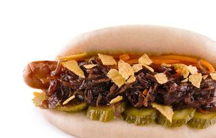 Hot dog with pickled cucumbers and crispy onions on a white background photo