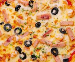 Delicious fresh seafood oven pizza on top view photo