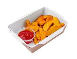 Fried potato wedges in takeaway box photo