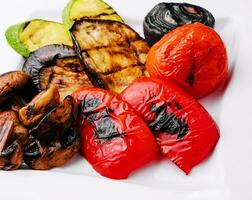 Grilled vegetables on white plate photo