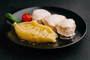 Healthy and filling dinner with grilled chicken breast, mashed potatoes photo