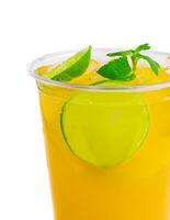 Alcohol cocktails with orange juice and lime slices photo