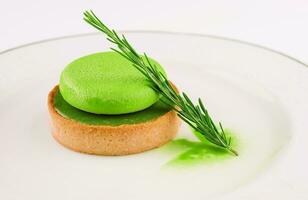 Green mousse cake with pistachio cream photo