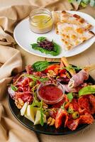 Appetizers table with antipasti snacks photo