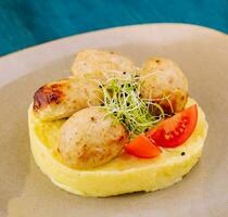 mashed potatoes with meat cutlets on plate photo