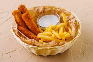 Fried chicken nuggets with french fries photo