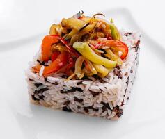 Mixed rice with grilled vegetables on white plate photo