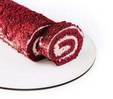 Sponge Swiss roll on white plate photo