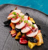 Roasted duck breast with vegetables in fruit sauce photo