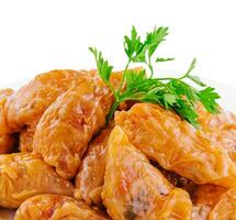 Cabbage rolls with rice and vegetables on plate photo