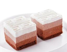 Delicious three layered chocolate mousse dessert photo