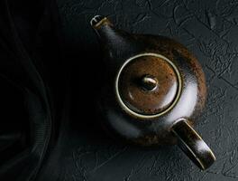 Harmony of Tea Kettle on Black Stone photo