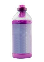 Plastic clean bottle full with violet detergent photo