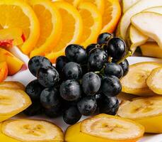 plate with different fruits close up photo