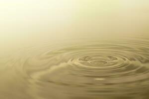 Waves of water are caused by falling droplets. 3d illustration. close-up view. photo