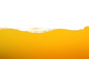 orange juice is isolated on white background. healthy fresh drink and natural waves. close up view. photo