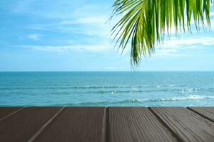 Beautiful foreground wooden floor and blue sea and sky background. photo