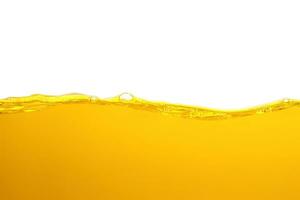 orange juice is isolated on white background. healthy fresh drink and natural waves. close up view. photo