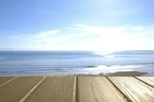 Beautiful foreground wooden floor and blue sea and sky background. photo