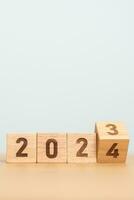 2023 change to 2024 year block on table. goal, Resolution, strategy, plan, start, budget, mission, action, motivation and New Year concepts photo