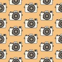 Cute seamless pattern light vintage camera in retro colors isolated on a beige background. Background, backdrop, wrapping paper. vector