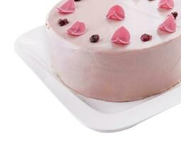 Pretty pink cake decorated with icing sugar roses photo