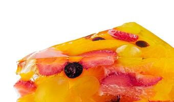 Jelly cake with fruit on white plate photo