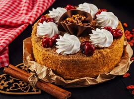 honey cake with cherry and whipped cream photo