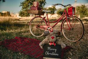 al aire libre Navidad sesión con bicicleta con regalos foto