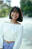 cheerful asian teenager toothy smiling face with happiness moment photo