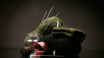 wool yarn, knitting needles and other tools for hand knitting. video