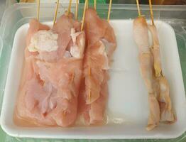 chicken breast fillet in plastic container photo