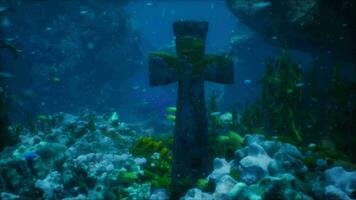 antique cross lies in underwater necropolis video