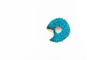 Donut with blue sprinkles isolated on white background. After some edits. photo