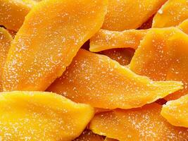 dried mango slices on white background. close up photo