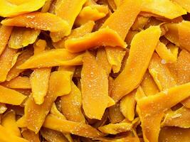 dried mango slices on white background. close up photo