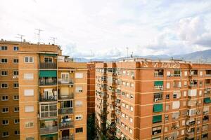 a view of the apartment buildings in a city photo