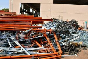 a pile of metal and other items in a warehouse photo