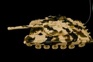 a toy tank is shown on a black background photo