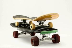 a skateboard with two wheels on top photo