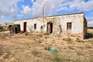 an old house in the middle of nowhere photo