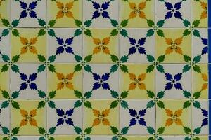 a colorful tile wall with blue and yellow flowers photo