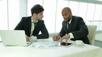 Two businessmen discussing important documents video