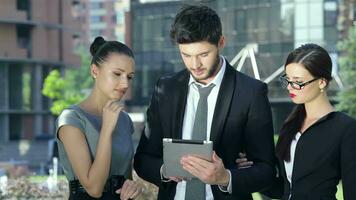 Close up of business partners are working on a tablet, get good news and rejoice video