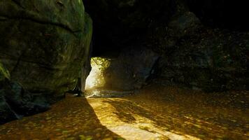 Empty road goes through the cave with glowing end video